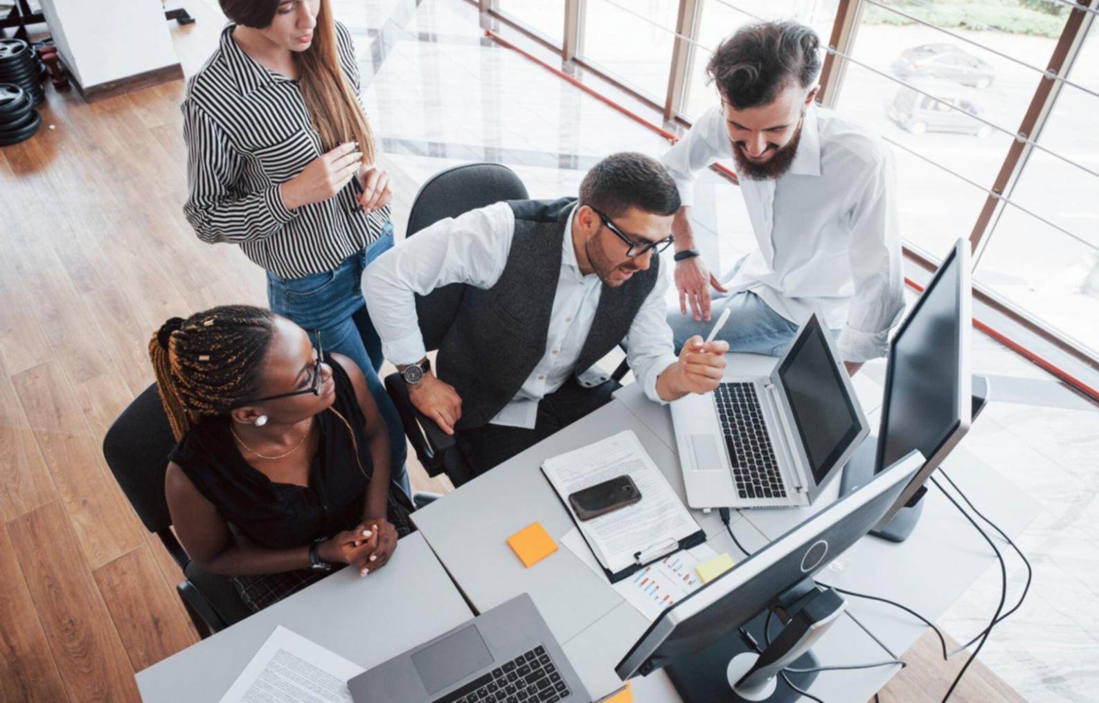 Students working together on system management projects in modern learning environment